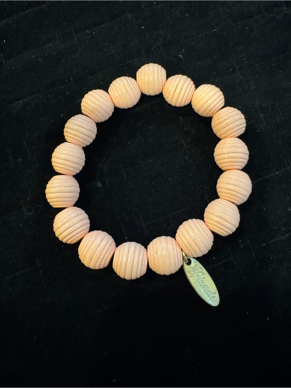 Plunder Pink Ribbed Beaded Stretch Bracelet Gold Tone Logo Charm
